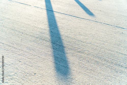 Harsh shadow on concrete cement floor outside
