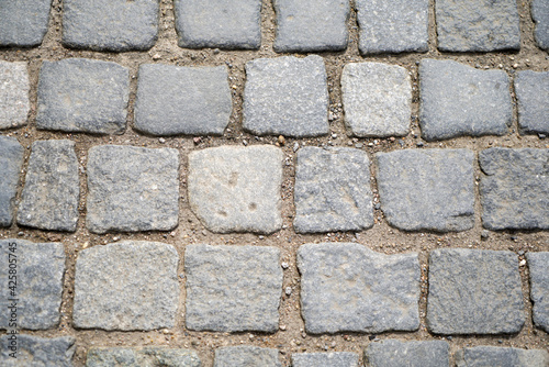 Structure of a stone as a pavement slab or as a brick
