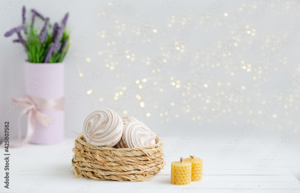 Coffee marshmallow on a white wooden background with yellow bokke. Light dessert for the holiday Coffee marshmallow on a white wooden background with yellow bokke. Light dessert for the holiday