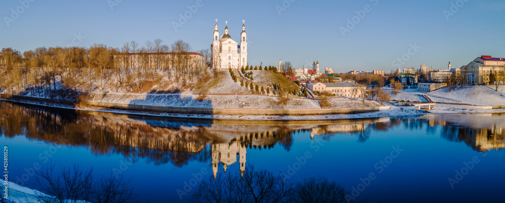 Panoramic view of Dvina river and city of Vitebsk with cathedral orthodox church on the hill and oold town. Aerial view. Travel concept.