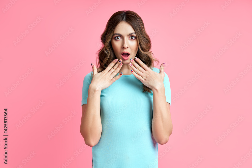 Portrait of a shocked surprised woman shouts on pink background. Portrait of a shocked surprised woman shouts on pink background.