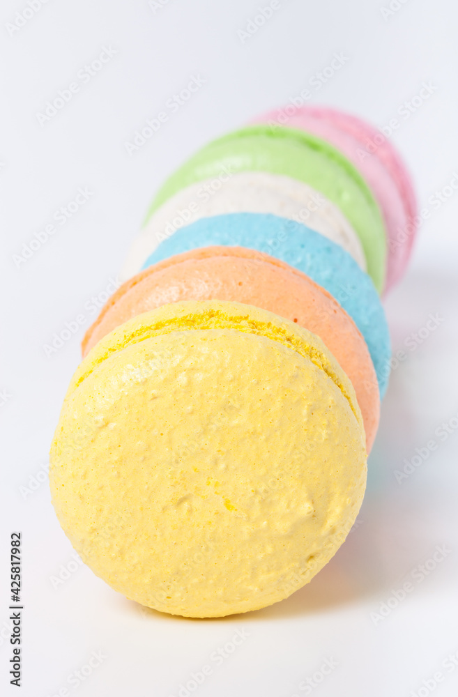 Colorful cake macaroons on a light background
