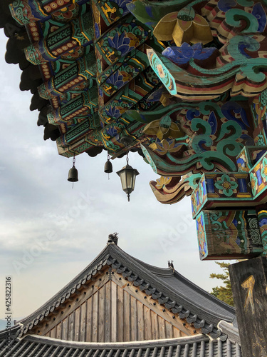 lantern and roof detail of buddhist temple on bukhan mountain in bukhansan national park, gyeonggi, south korea