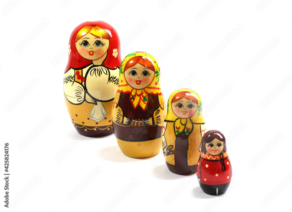 Collection of Wooden Nesting Stacking Dolls on White Background