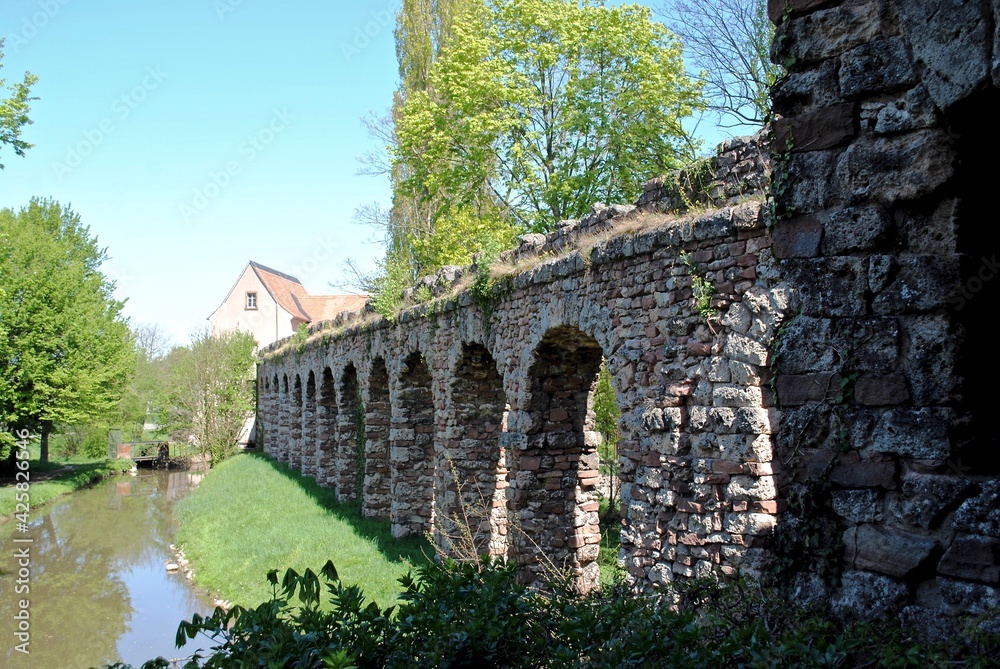 Schwetzingen, Germany - 2015: Schloss Schwetzingen, or Schwetzingen Palace is a schloss in the German state of Baden-Württemberg. Artificial Roman ruins of aqueducts accent the formal garden. 