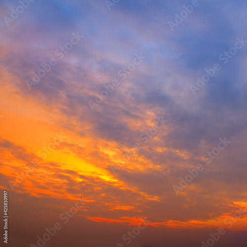 scenic of the strong sunrise and cloud on the orange sky.