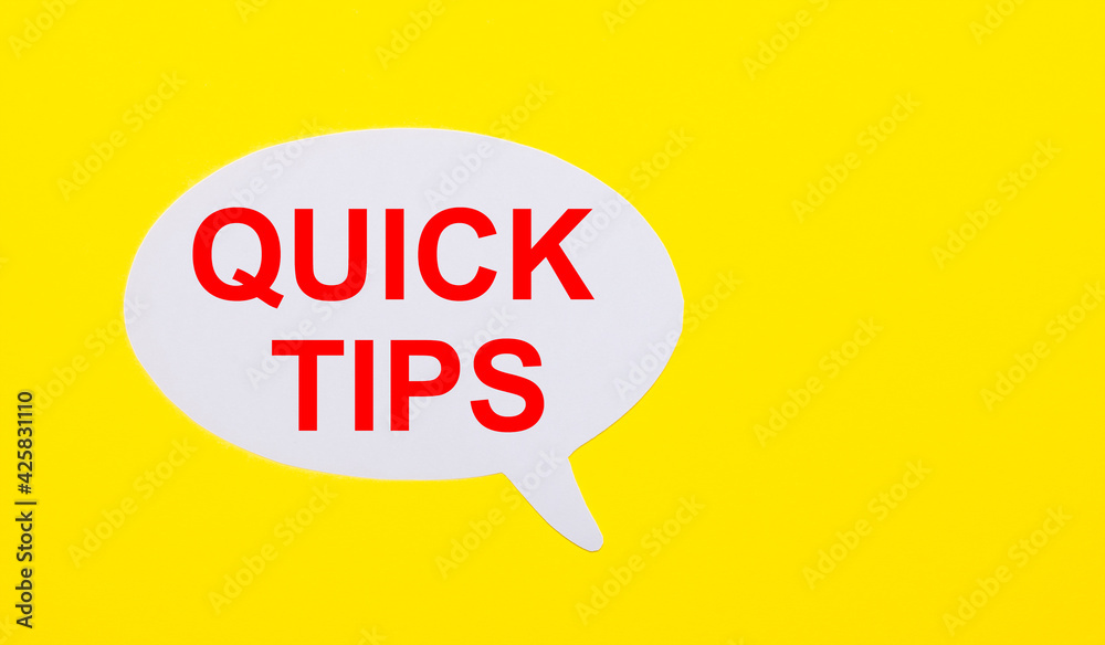 On a bright yellow background, white paper with the words QUICK TIPS On a bright yellow background, white paper with the words QUICK TIPS