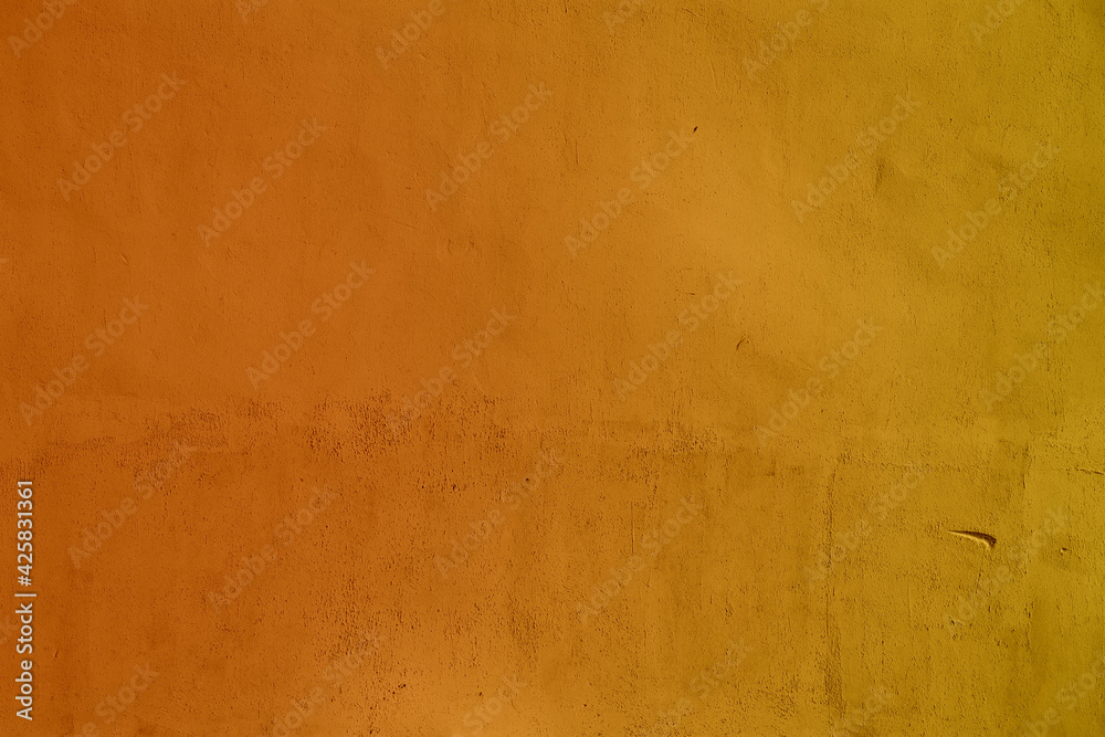 Orange gradient cement wall texture with pattern. Orange or dark yellow background