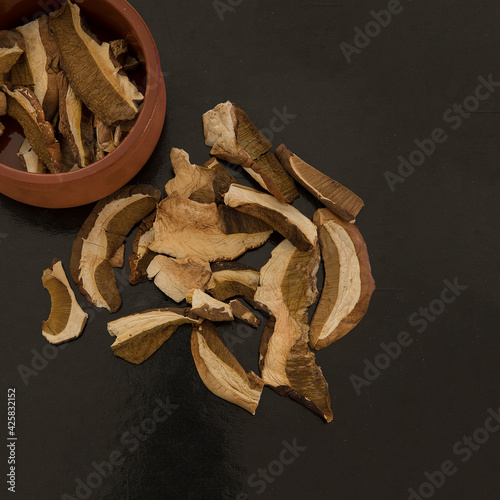 Dried Porcini Mushrooms. Toplay View. Boletus edulis mushrooms on a black background . Stock Image photo