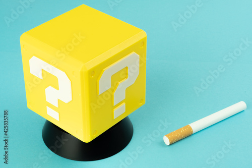 Question mark and cigarette and glass of whiskey