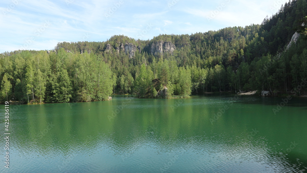 Naklejka premium The flooded quarry in the beautiful rocky nature at Adrspach, Czech republic