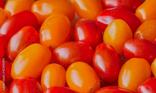 Red and yellow plum tomatoes. © Mark
