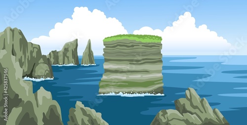 Sea landscape with rocks, cliffs, stones, blue sky with fluffy clouds.