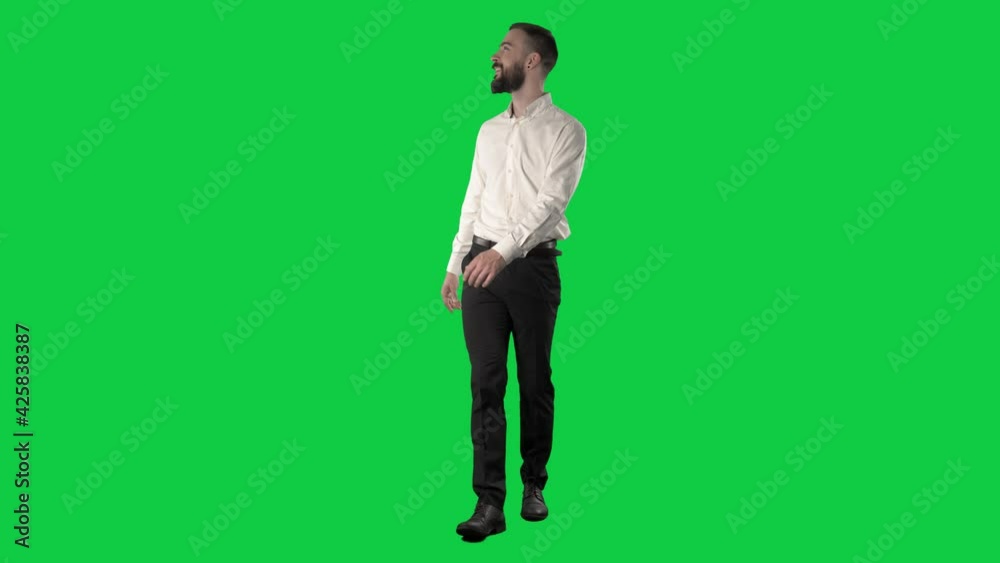 Amazed and excited business man looking around fascinated. Full length on green screen chroma background. Amazed and excited business man looking around fascinated. Full length on green screen chroma background.