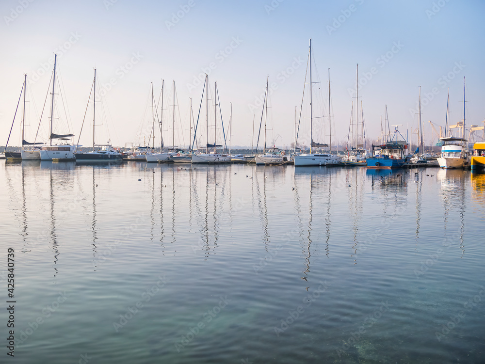 Many boats and yachts anchored at the touristic port or harbor in Mangalia, Constanta