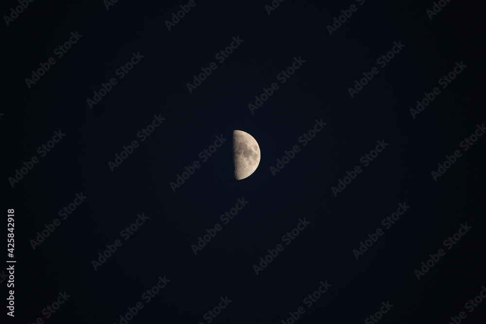 Brightly shining moon in a cloudless night sky Brightly shining moon in a cloudless night sky