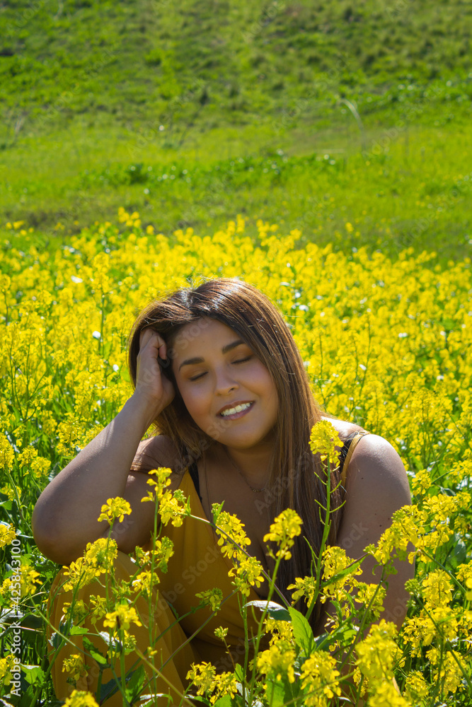 beautiful mexican woman enjoying picnic in field full of flowers with relaxed face beautiful mexican woman enjoying picnic in field full of flowers with relaxed face
