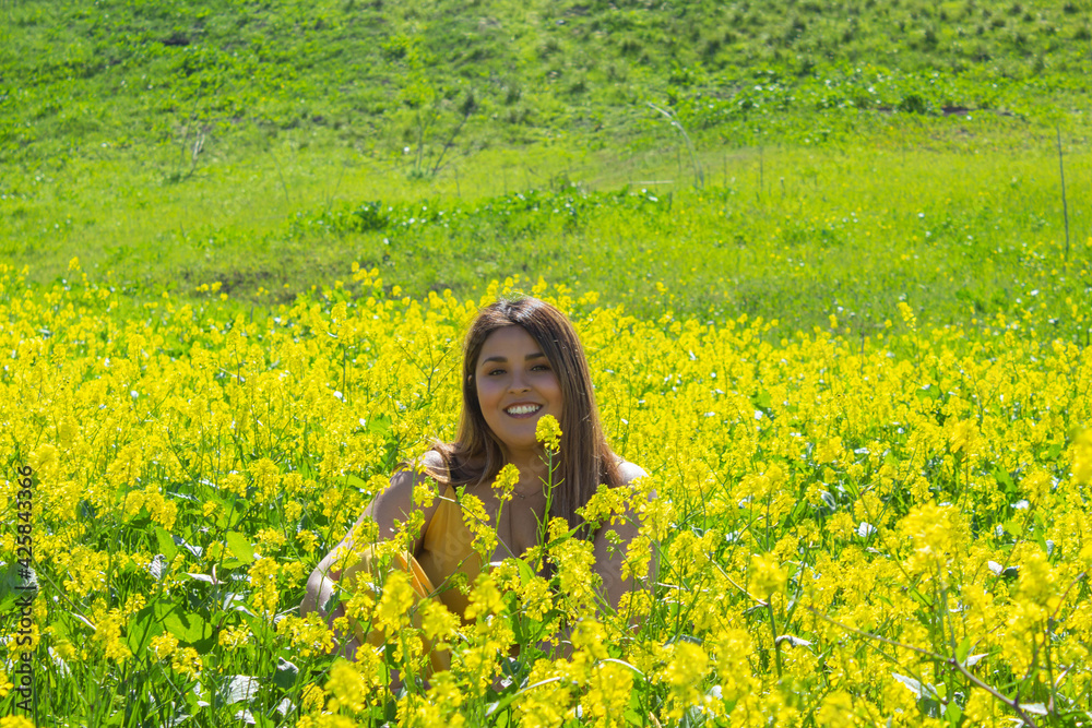 beautiful Mexican woman doing a picnic in a landscape full of flowers beautiful Mexican woman doing a picnic in a landscape full of flowers