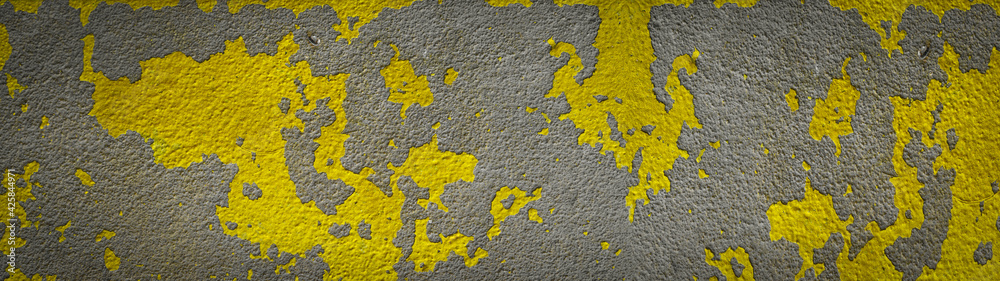 Obraz premium Abstract yellow Pantone gray colored painted damaged peeled off plaster concrete cement facade wall texture background banner panorama ( color of the year )