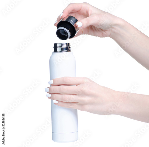 White thermos hot drink in hand on white background isolation