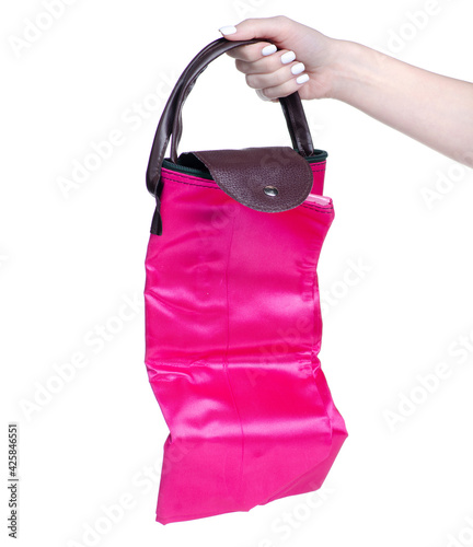 Grocery shopping foldable bag in hand on white background isolation