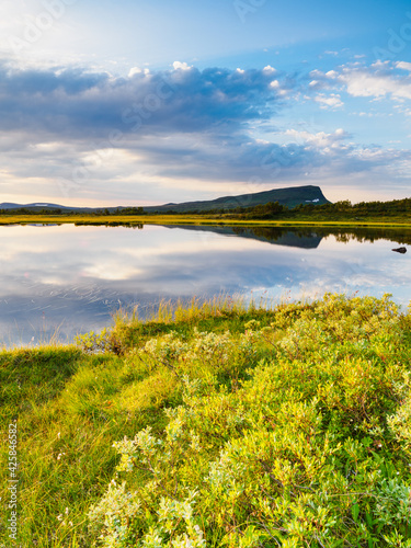 Lake in front of mountains photo