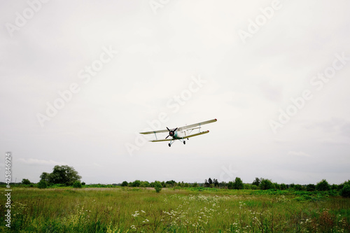Private aircraft. Light aircraft flying over the field