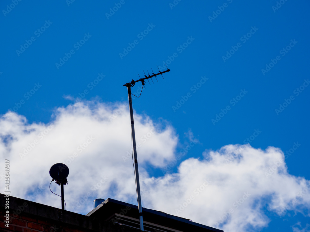traditional style television ariel on a roof top traditional style television ariel on a roof top