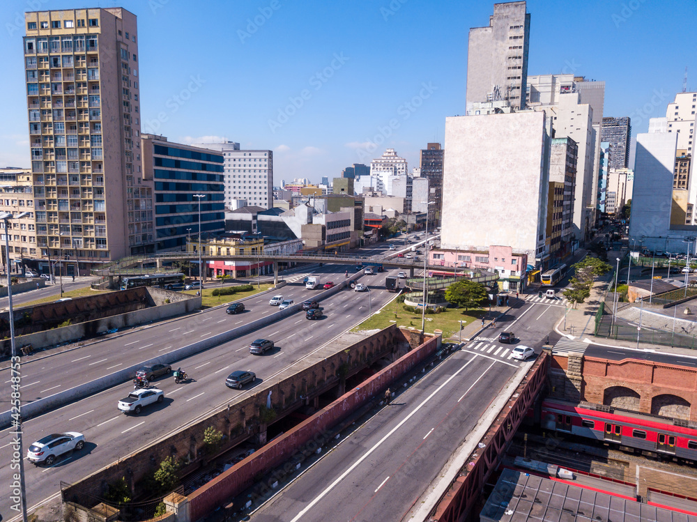 Beautiful aerial view of Sao Paulo city skyline, buildings and cars in the street on sunny summer day. Brazil. Concept of urban, cityscape, metropolis, pollution, architecture.