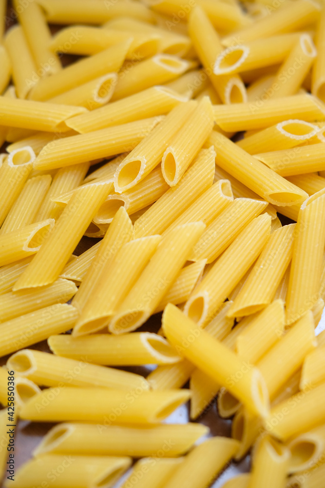 Healthy food on kitchen. Large yellow pasta Healthy food on kitchen. Large yellow pasta