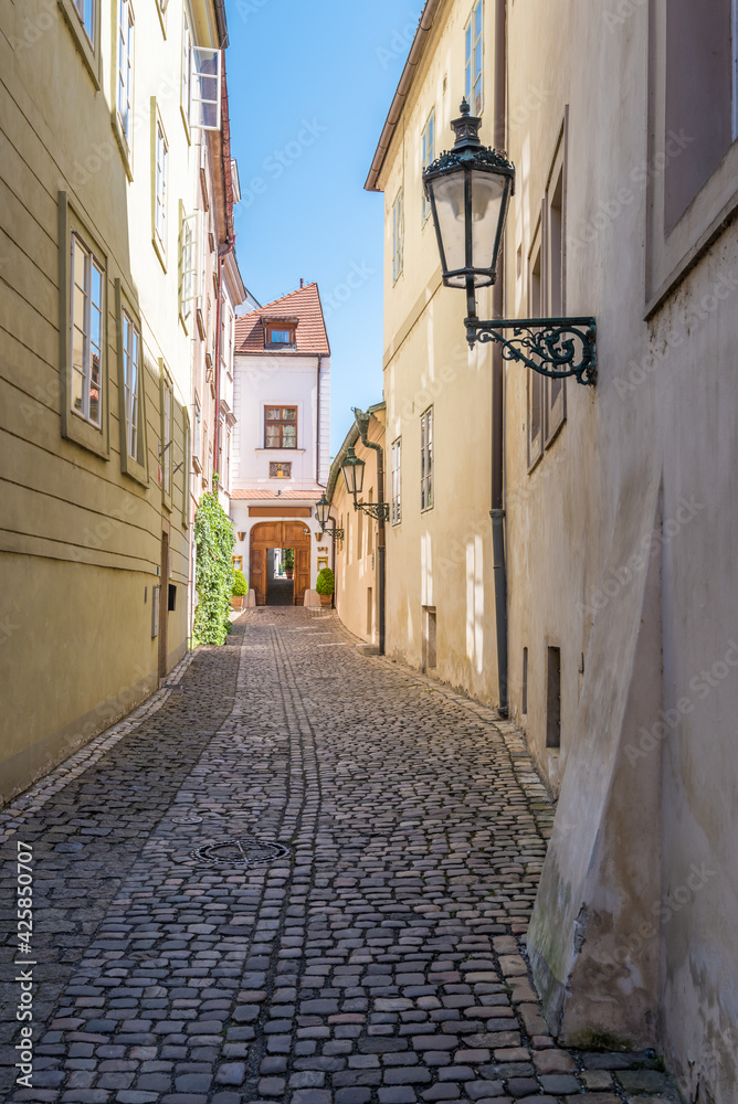 View to the street in the old center of Prague - the capital and largest city of the Czech Republic - travel background