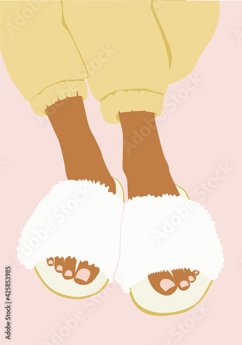 Girl in home furry slippers and yellow pants on the pink isolated background.