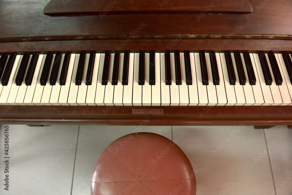 antique upright piano over 100 years old. Stock Photo Adobe