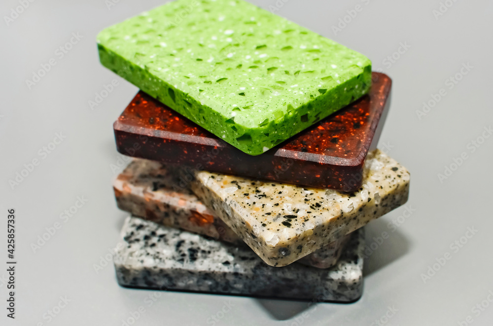 A stack of samples of artificial stone for design.