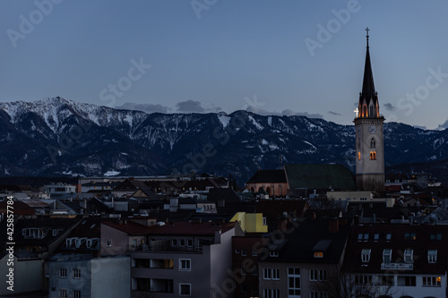 Panoramic view in the evening of the Catholic Church and the ancient Austrian city of Villach