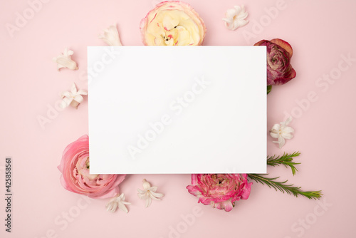 Beautiful blank stationery flat lay with fresh flowers