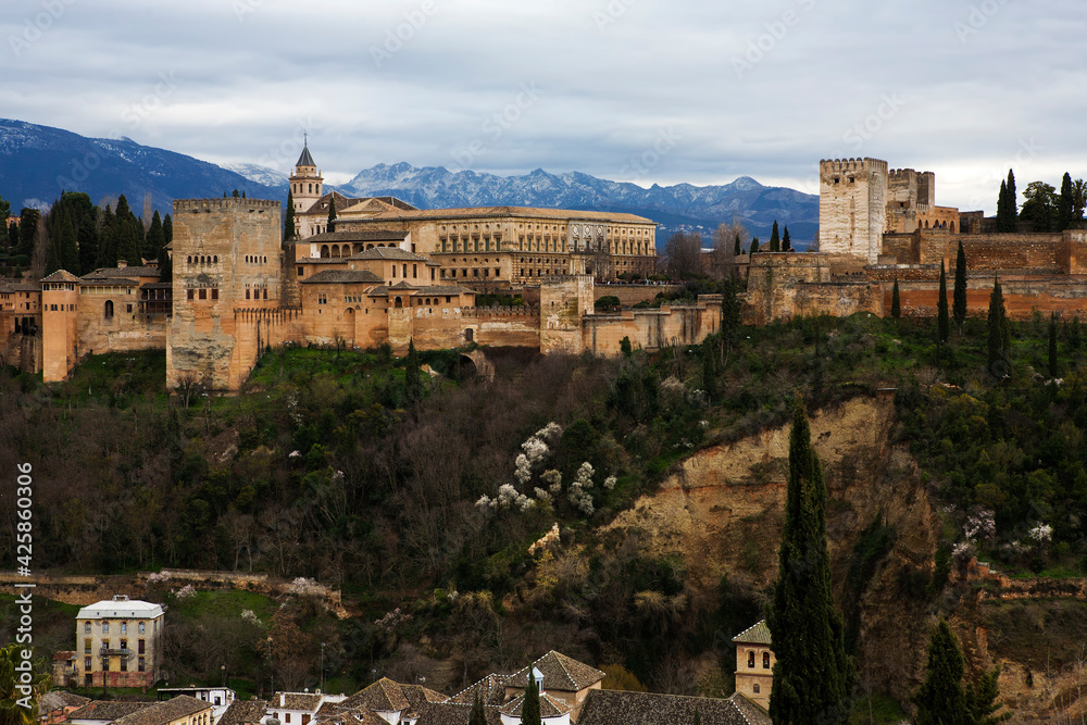 Classic view of the Alhambra from Mirador de San Nicolás, El Albaicín, Granada, Andalusia, Spain, at evening