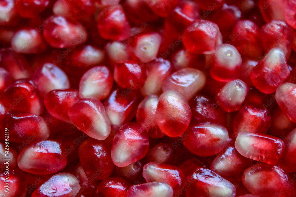 Pomegranate seeds. Macro. Close up. Red pomegranate seeds. Pomegranate seeds. Macro. Close up. Red pomegranate seeds.