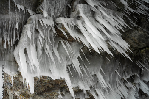 ice and snow patterns and icicles on rocks and in a cave