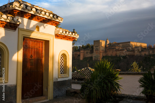 View of the Alhambra palace complex across the Darro valley from Placeta Comino, El Albaicín, Granada, Andalusia, Spain photo