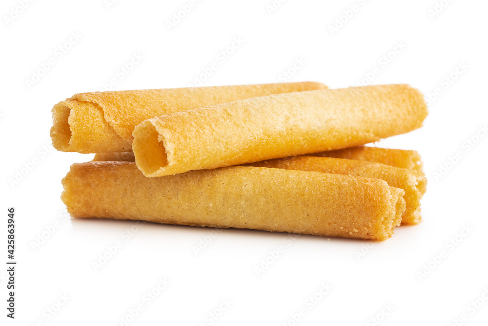 Sweet waffle tubes rolls isolated on white background. Sweet waffle tubes rolls isolated on white background.