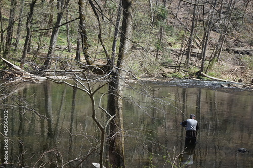 Male Adult Fishing in the Wissahickon Creek Early Spring photo