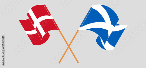 Crossed and waving flags of Denmark and Scotland