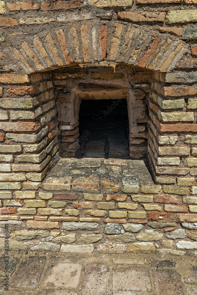 Bread oven in an ancient bakery in the Roman ruins of Italica. Spain.