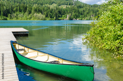 Reflection in water of mountain lakes and boats. Alta lake in Whistler  Vancouver  Canada. Beauty world.