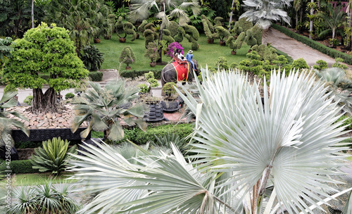 Tourists ride elephants in the park of Nong Nooch