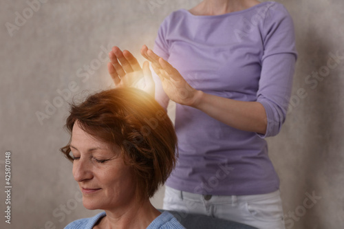 Reiki healing treatment . Energy therapy, alternative medicine concept. photo