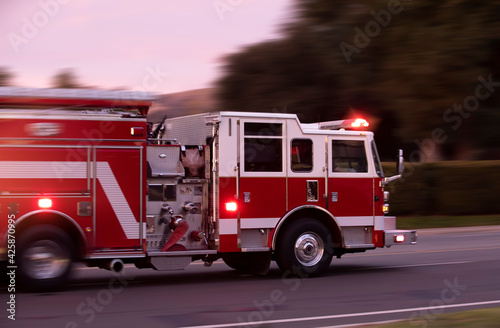 Canvas Print A fire engine races to the scene of an emergency.
