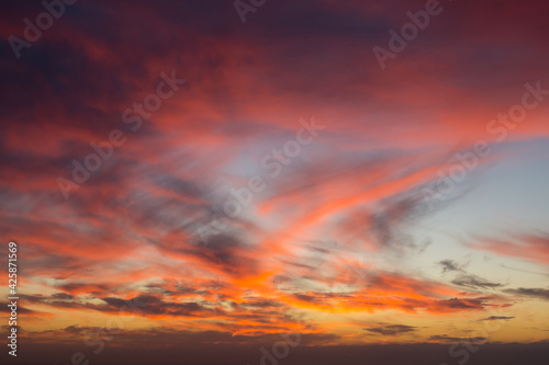 colorful sky at sunrise and abstract dramatic cloud background © Adria