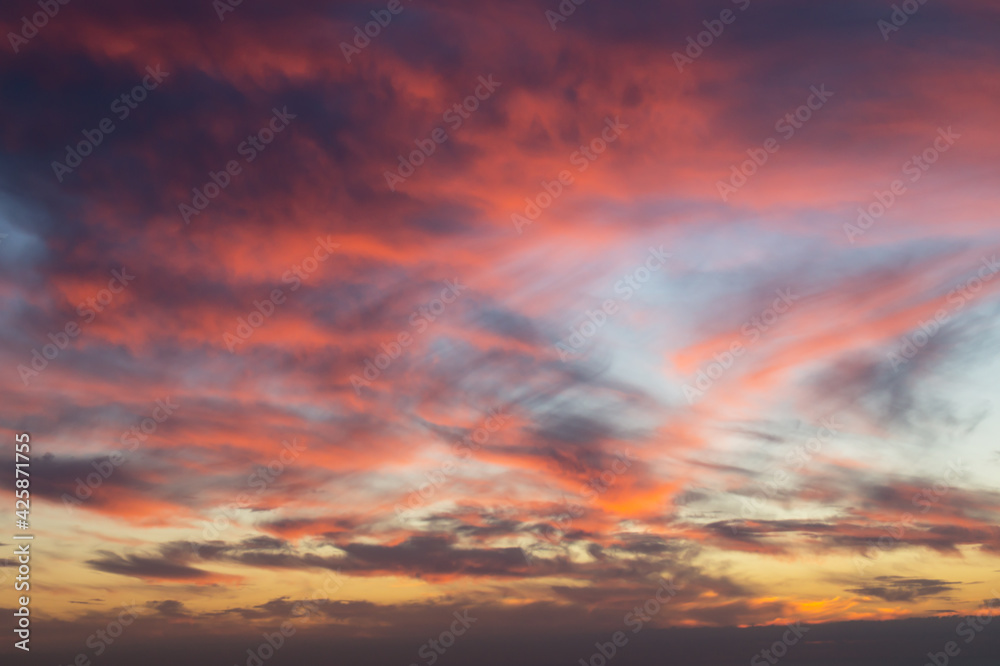 colorful sky at sunrise and abstract dramatic clouds